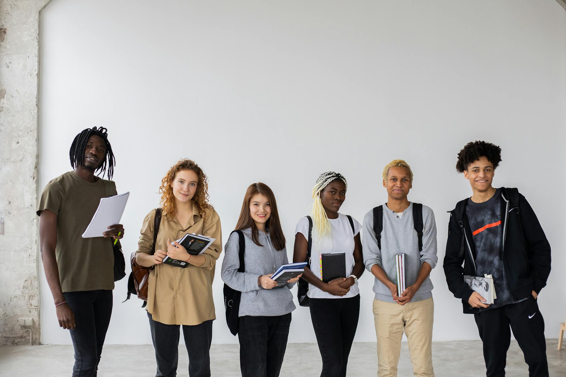 group of multiethnic students with books and documents